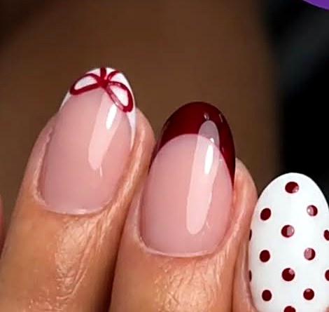 Red bow and polka dot nail design at Uvabon Nail Salon