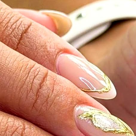 Nude nails with gold outline art at Uvabon Nail Salon