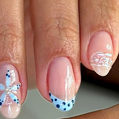 Blue bow and polka dot French nails at Uvabon Nail Salon