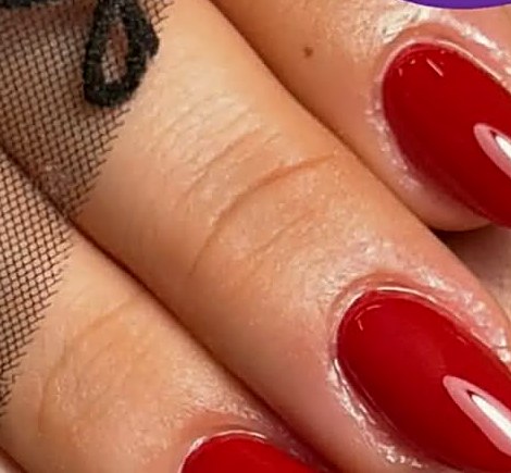 Glossy red manicure at Uvabon Nail Salon