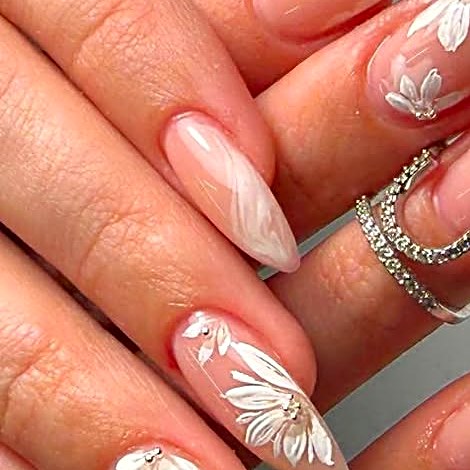 Long Gel X nails with white floral art at Uvabon Nail Salon